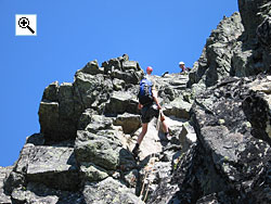 The 15 metre crag on the west ridge of stre Torfinnstind is an abseil or a grade III climb